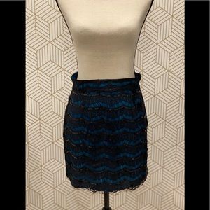 FRANCESCA’S Laced Overlay Mini Skirt